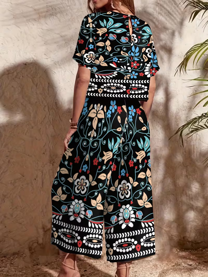 versatile vacation outfit with floral print, round-neck short top and comfortable loose wide-leg pants featuring elastic waistband